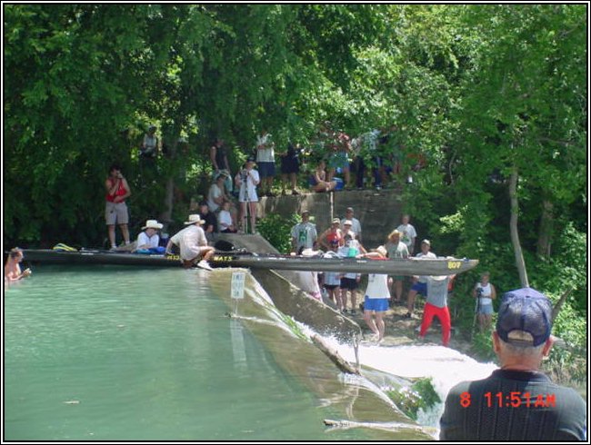 Easing a boat over Staples Dam