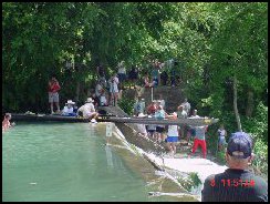 Easing a boat over Staples Dam
