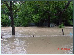 Flood waters at 4th Crossing into the houses