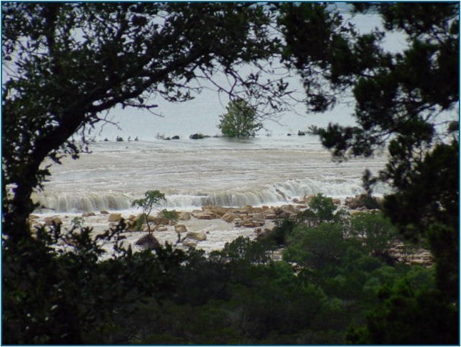 Water comes over the spillway for the first time in Canyon Lake history