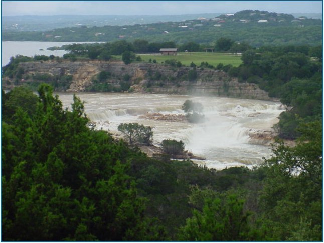 Water from the spillway comes roaring toward Horseshoe Falls Estates and the Lower Guadalupe River