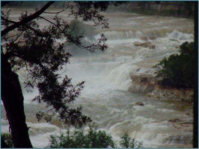 Close-up view of the water pouring over the spillway at Canyon Lake