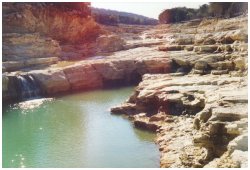 New pool created by flood erosion on the spillway